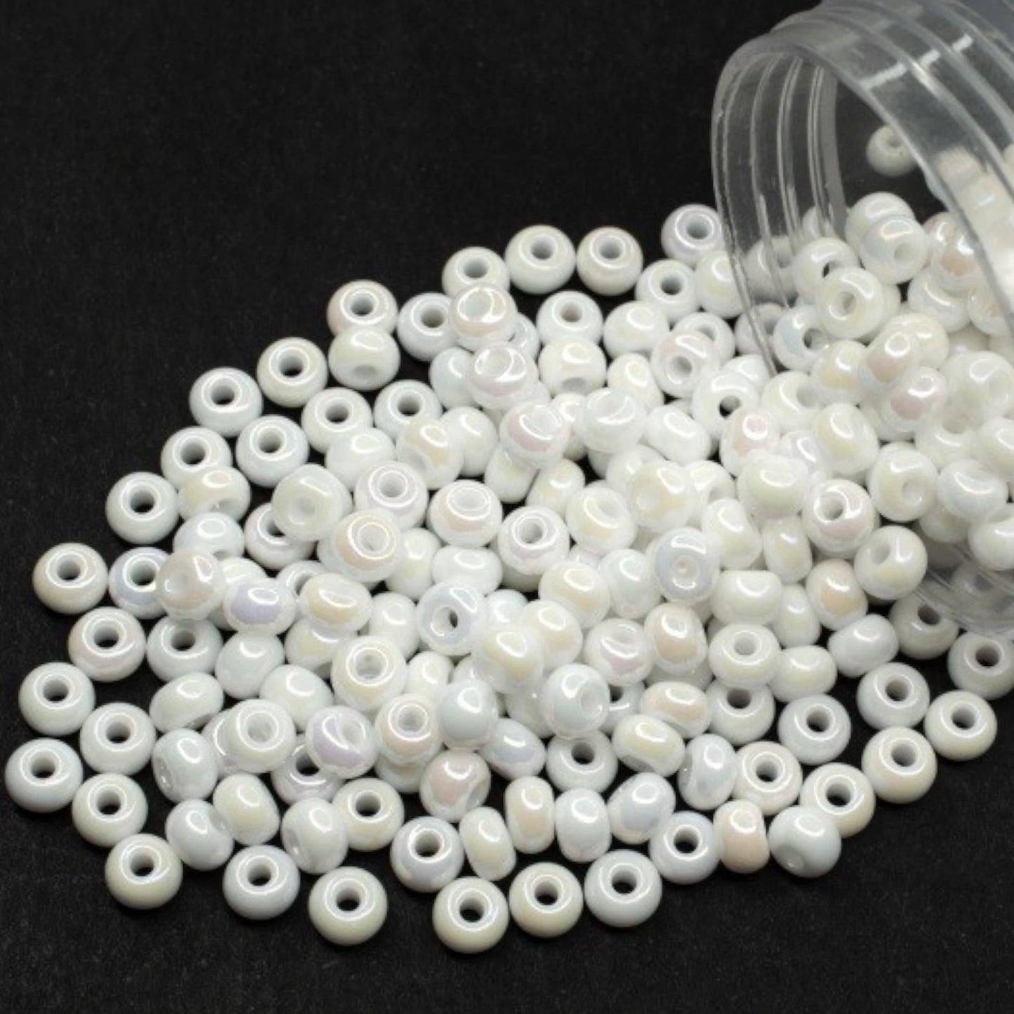 10/0 46205 Preciosa Seed Beads. Opaque rainbow white.