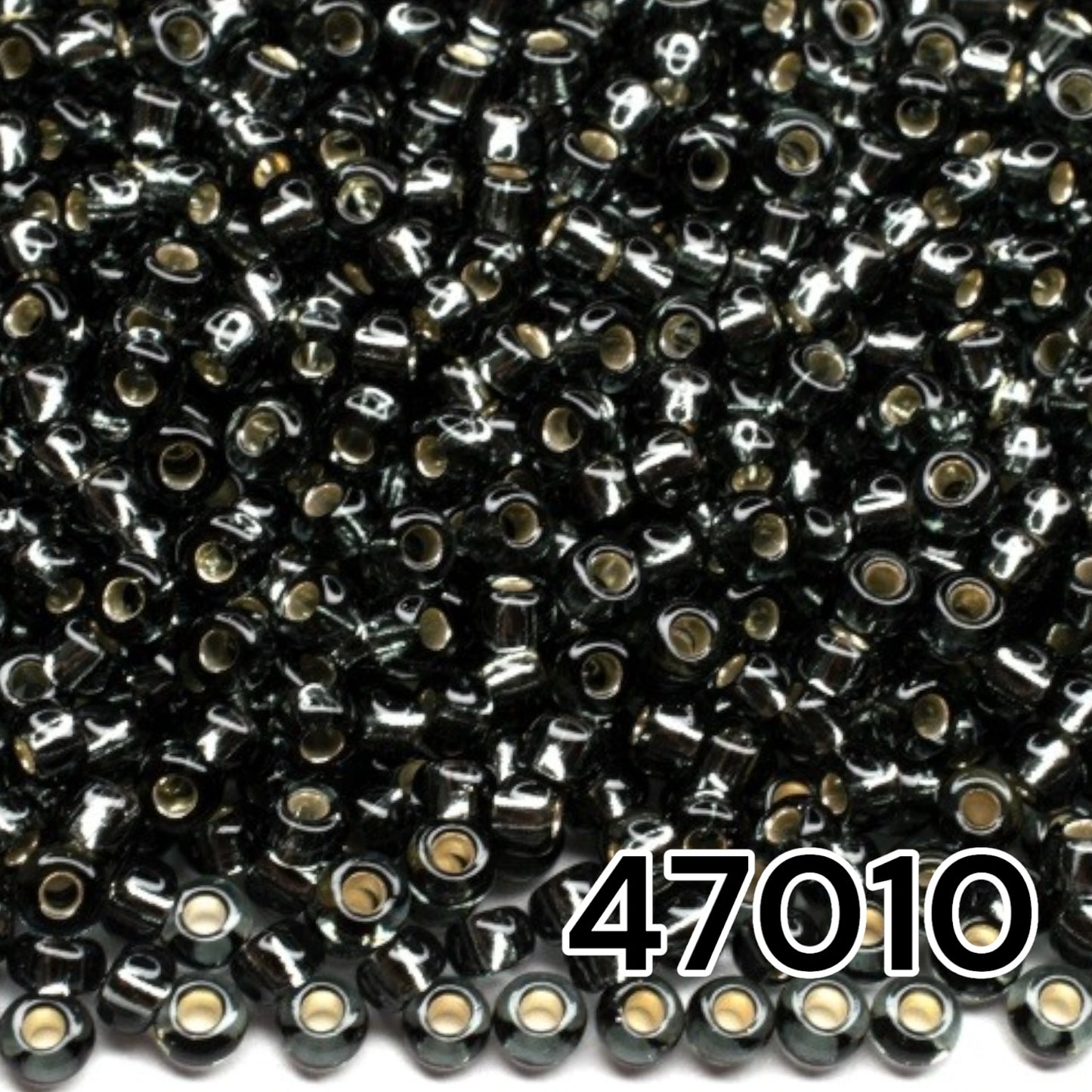 10/0 47010 Preciosa Seed Beads. Black transparent Silver lined.