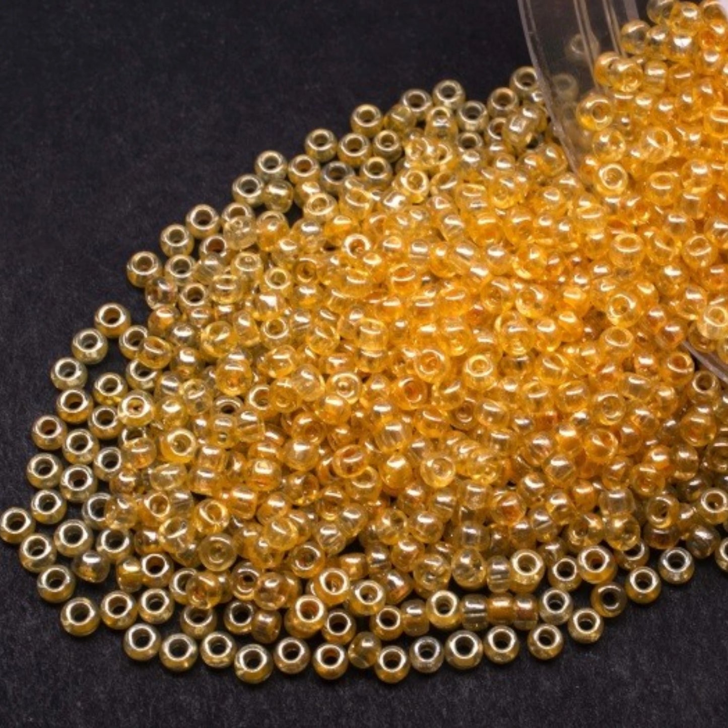 10/0 48013 Preciosa Seed Beads. Yellow Crystal lustered.