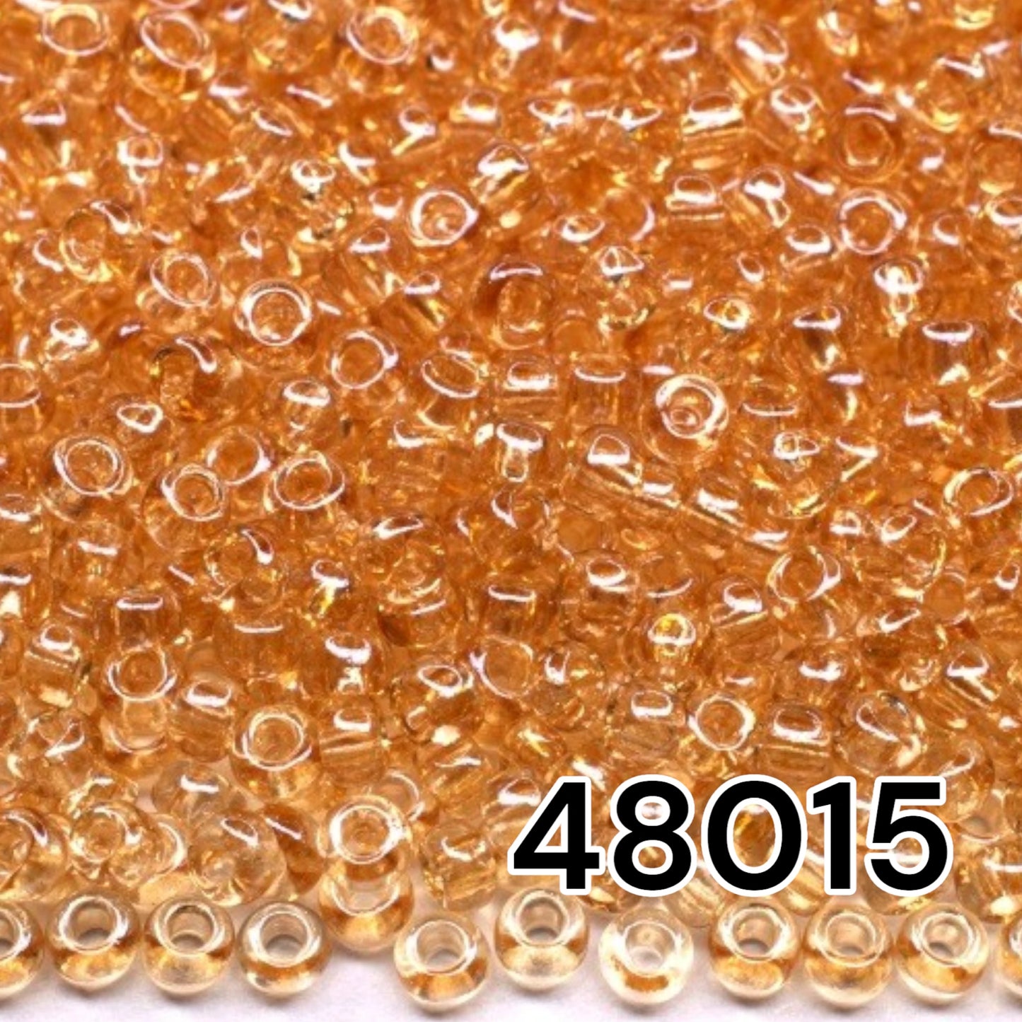 10/0 48015 Preciosa Seed Beads. Beige Crystal lustered.