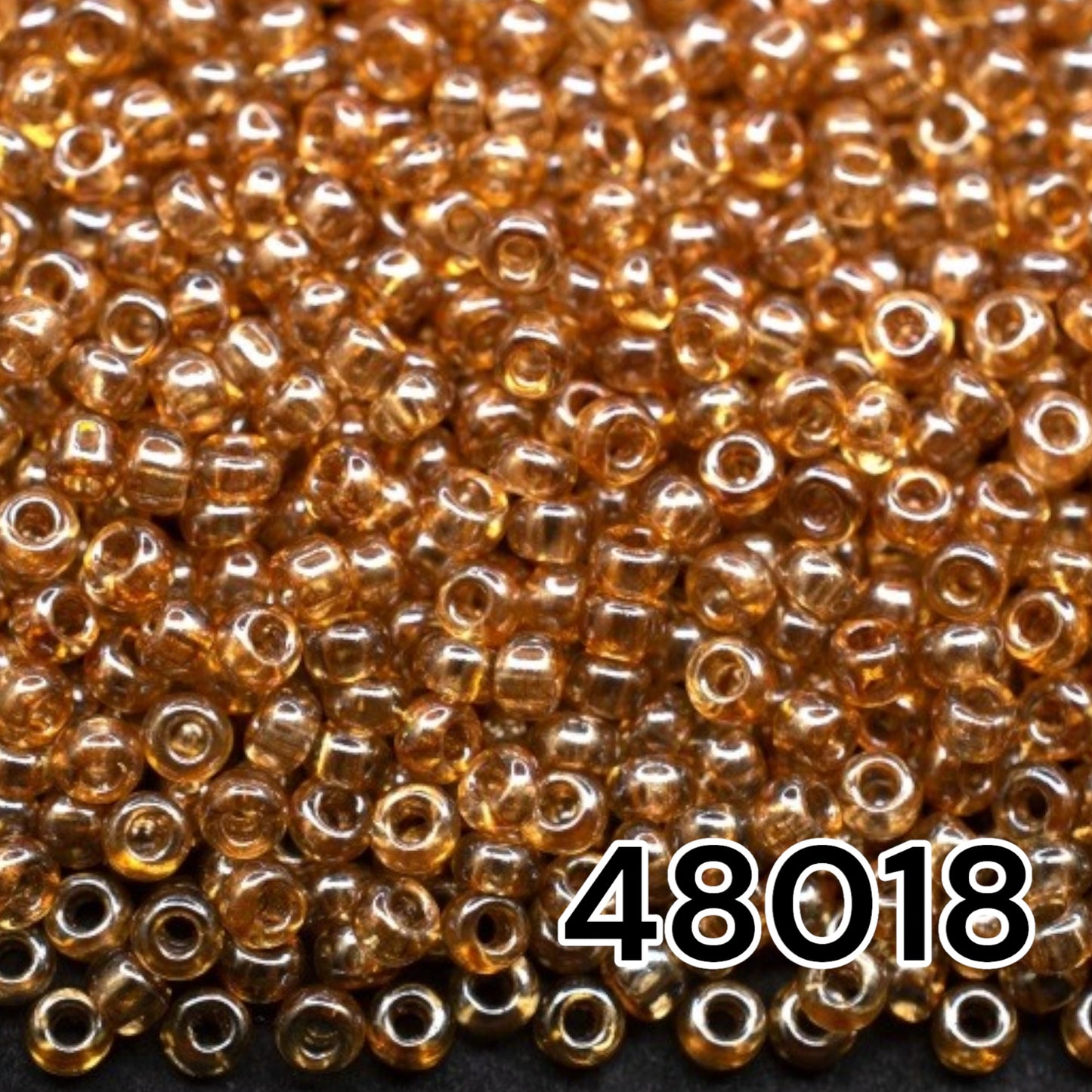 10/0 48018 Preciosa Seed Beads. Crystal Color Lustered.