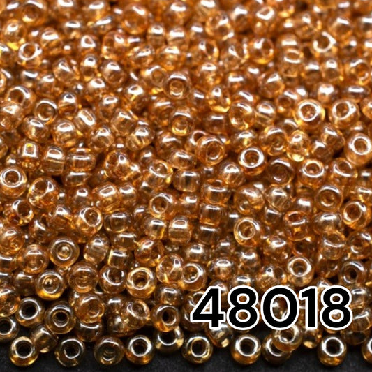 10/0 48018 Preciosa Seed Beads. Crystal Color Lustered.