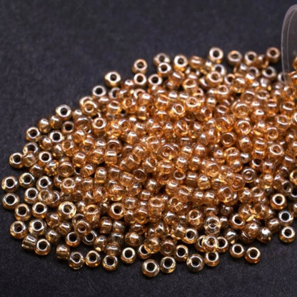 10/0 48018 Preciosa Seed Beads. Crystal Color Lustered.