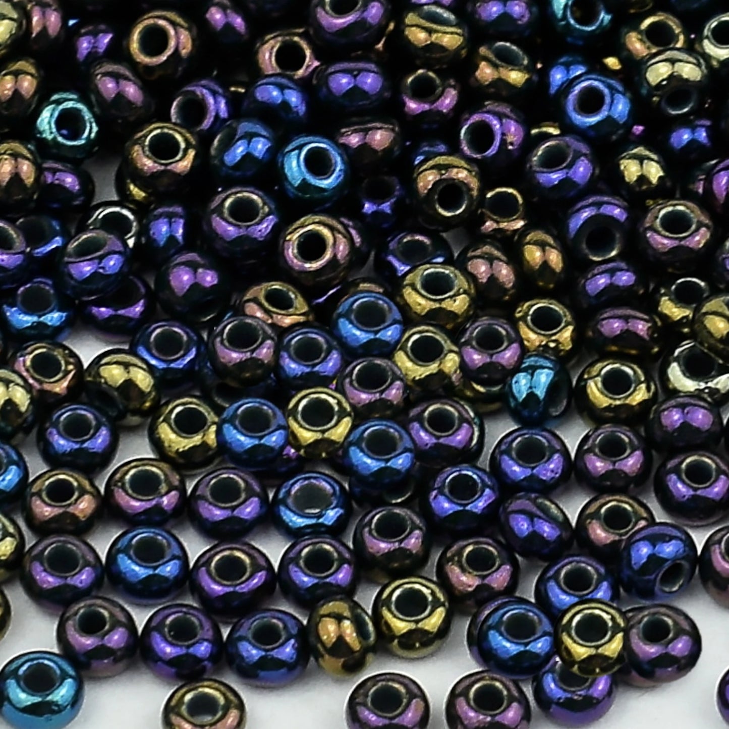 10/0 54270 Preciosa Seed Beads. Opaque rainbow.