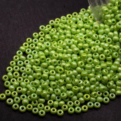 10/0 54310 Preciosa Seed Beads. Opaque rainbow green.