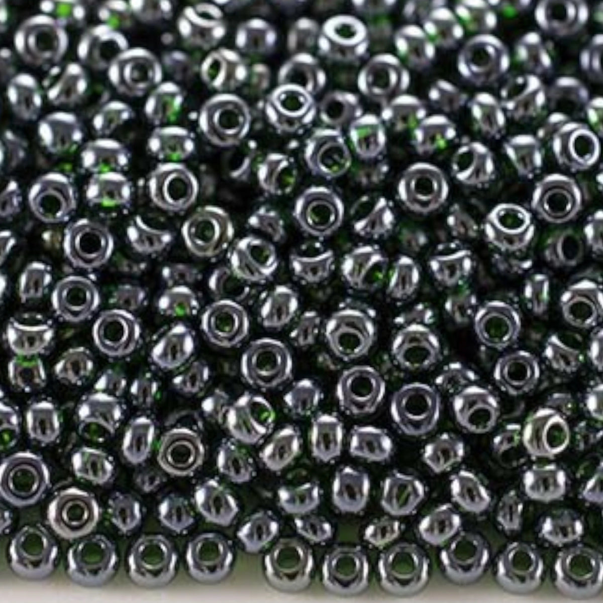 10/0 56150 Preciosa Perline di vetro ceche Rocaille 2.3mm. Verde scuro trasparente Sfinx.
