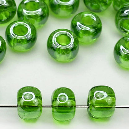 2/0 56430 Preciosa Czech Glass Koraliki Rocailles 6.1mm. Zielony Transparentny Sfinx.