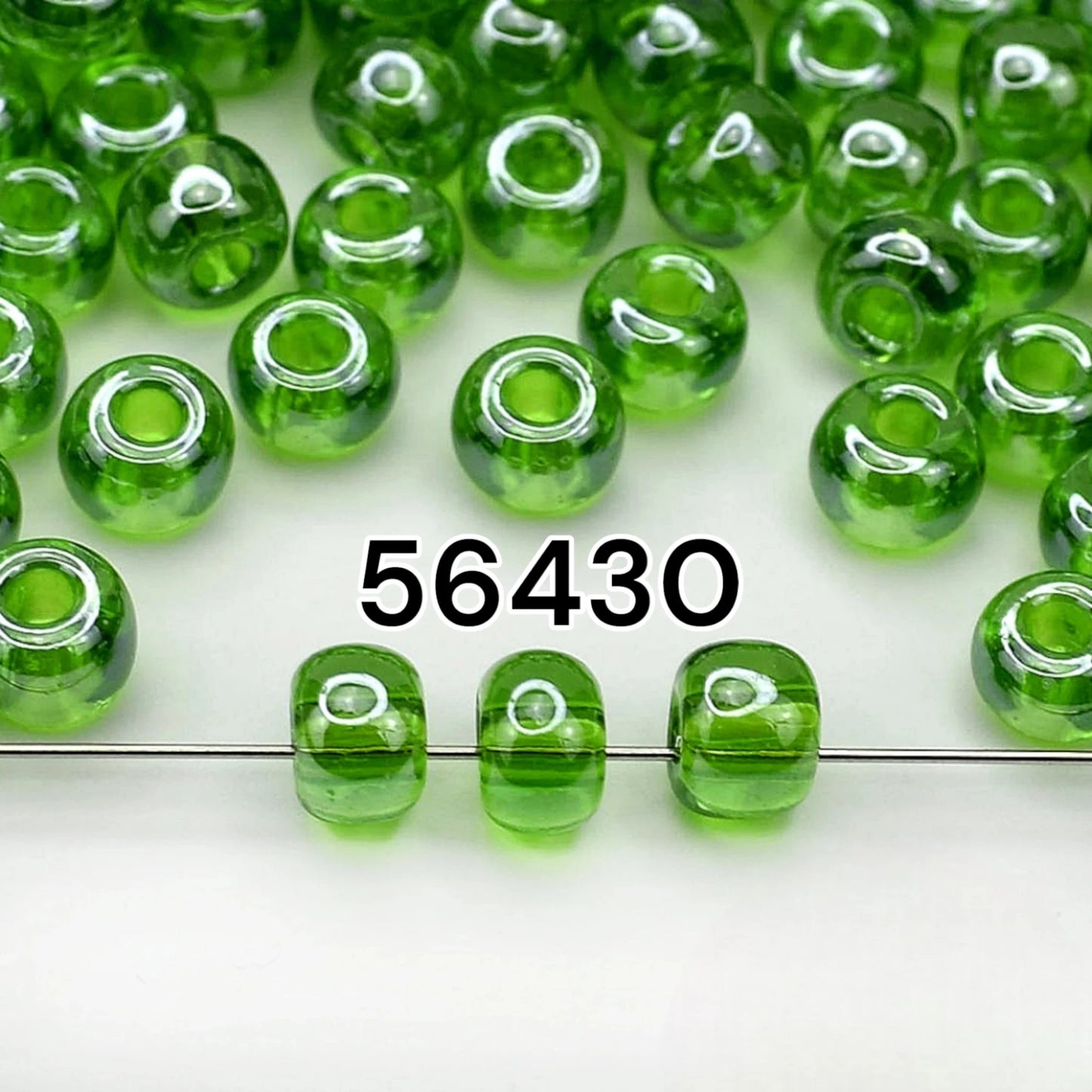2/0 56430 Preciosa Czech Glass Koraliki Rocailles 6.1mm. Zielony Transparentny Sfinx.