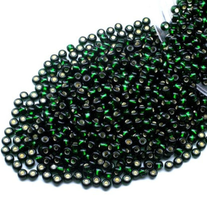 10/0 57150 Perles de graines Preciosa. Vert transparent doublé argent.