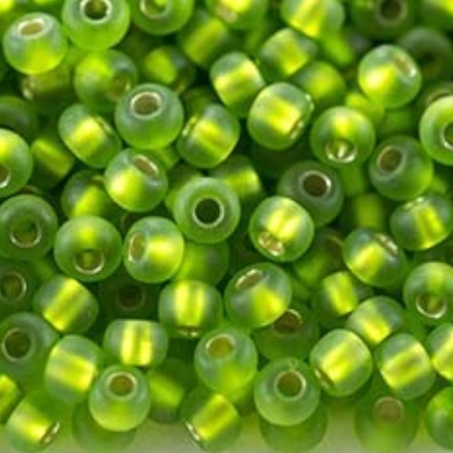 10/0 57430matte Preciosa Seed Beads. Green transparent Silver lined.