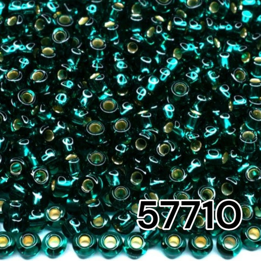 10/0 57710 Perles de graines Preciosa. Vert bleu transparent doublé argent.