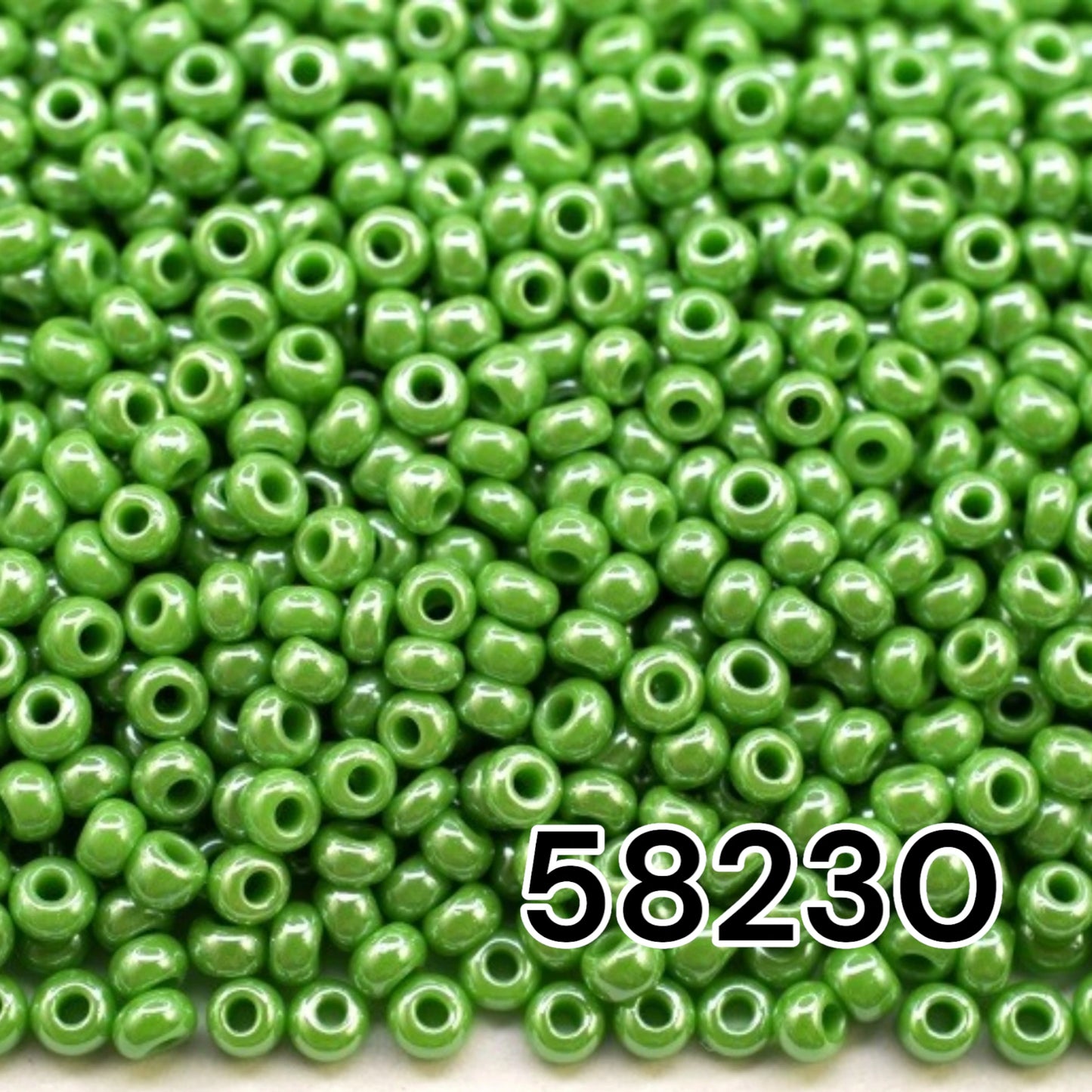 10/0 58230 Preciosa Seed Beads. Opaque Sfinx green.