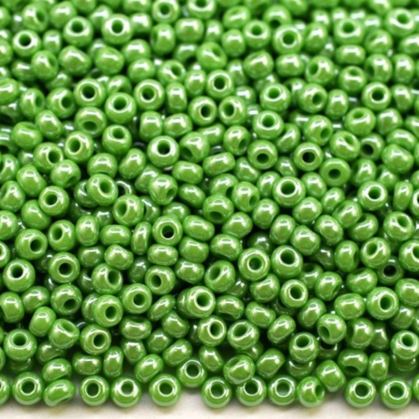 10/0 58230 Preciosa Seed Beads. Opaque Sfinx green.