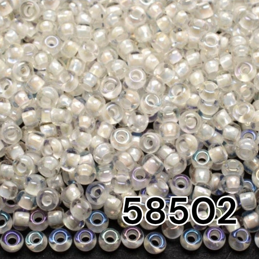 10/0 58502 Preciosa Seed Beads Rocailles. White Lined Transparent Rainbow.