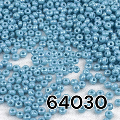 10/0 64030 Preciosa Seed Beads. Opaque rainbow light blue.