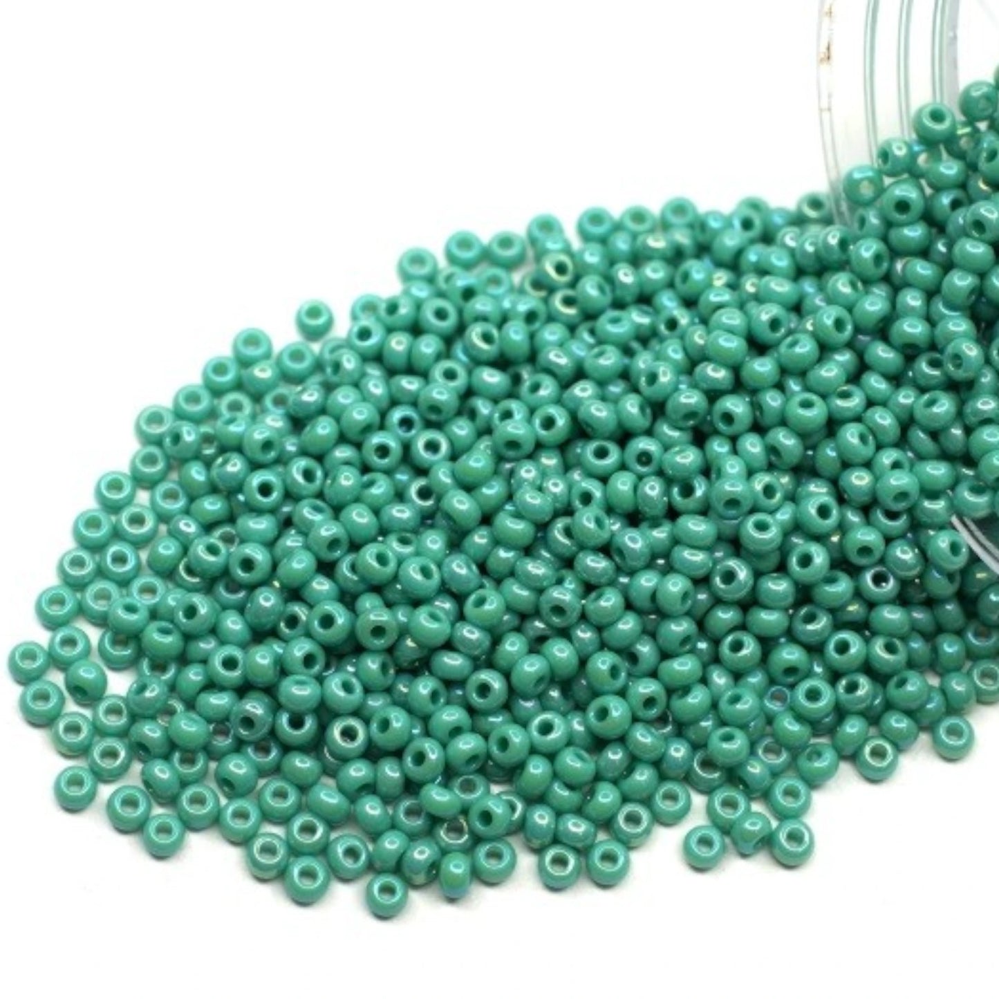 10/0 64130 Preciosa Seed Beads. Opaque rainbow blue green.