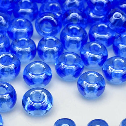 2/0 66150 Preciosa Tjeckiska glaspärlor Rocaillepärlor 6.1mm. Blå transparent Sfinx.