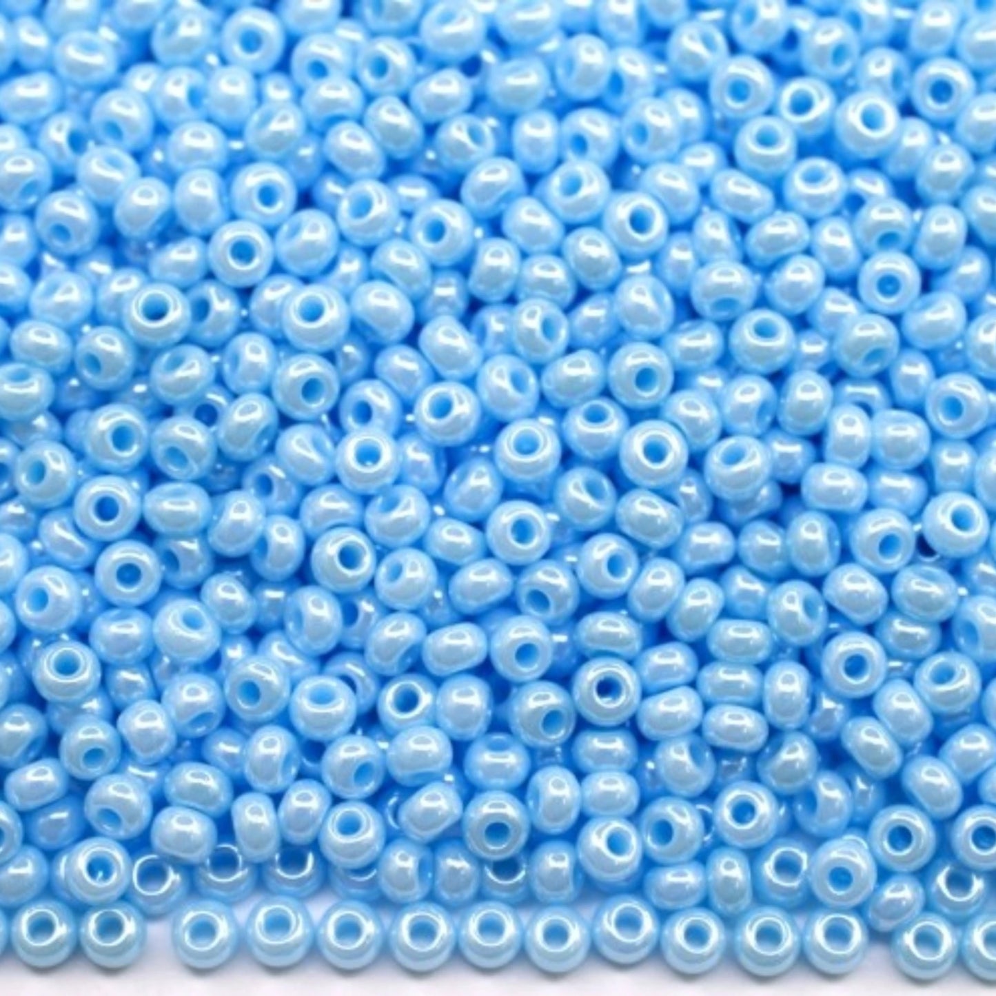 10/0 68000 Preciosa Seed Beads. Opaque Sfinx light blue.