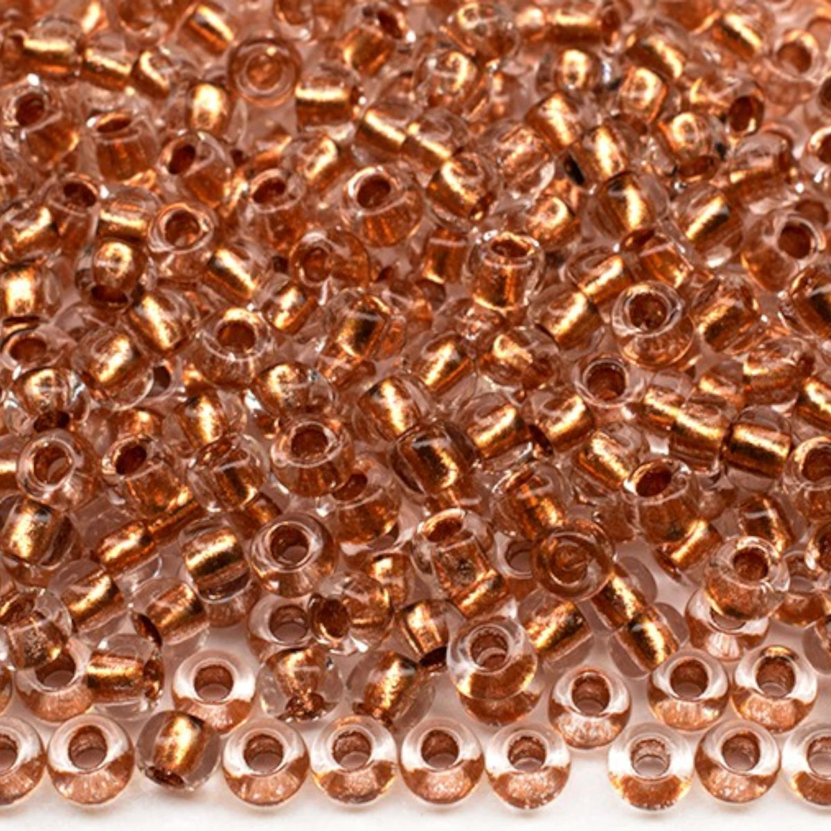 10/0 68105 Preciosa Tschechische Glasperlen Rocailles 2.3mm. Kristall, Kupfergefüttert Metallic.