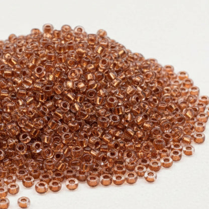 10/0 68105 Preciosa Tschechische Glasperlen Rocailles 2.3mm. Kristall, Kupfergefüttert Metallic.