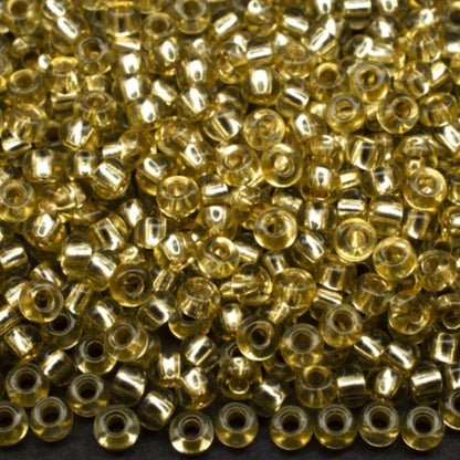 10/0 78151 Preciosa Czech Glass Koraliki Rocailles 2.3mm. Zielono-żółte 2 barwione kryształowe, srebrne wykończenie.