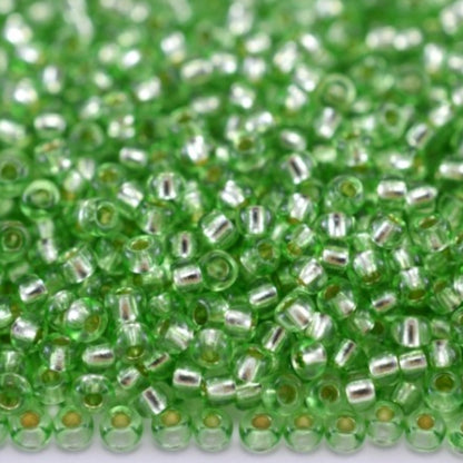 10/0 78161 Preciosa Czech Glass Seed Beads Rocailles 2.3mm. Green 2 dyed Crystal, Silver Lined.