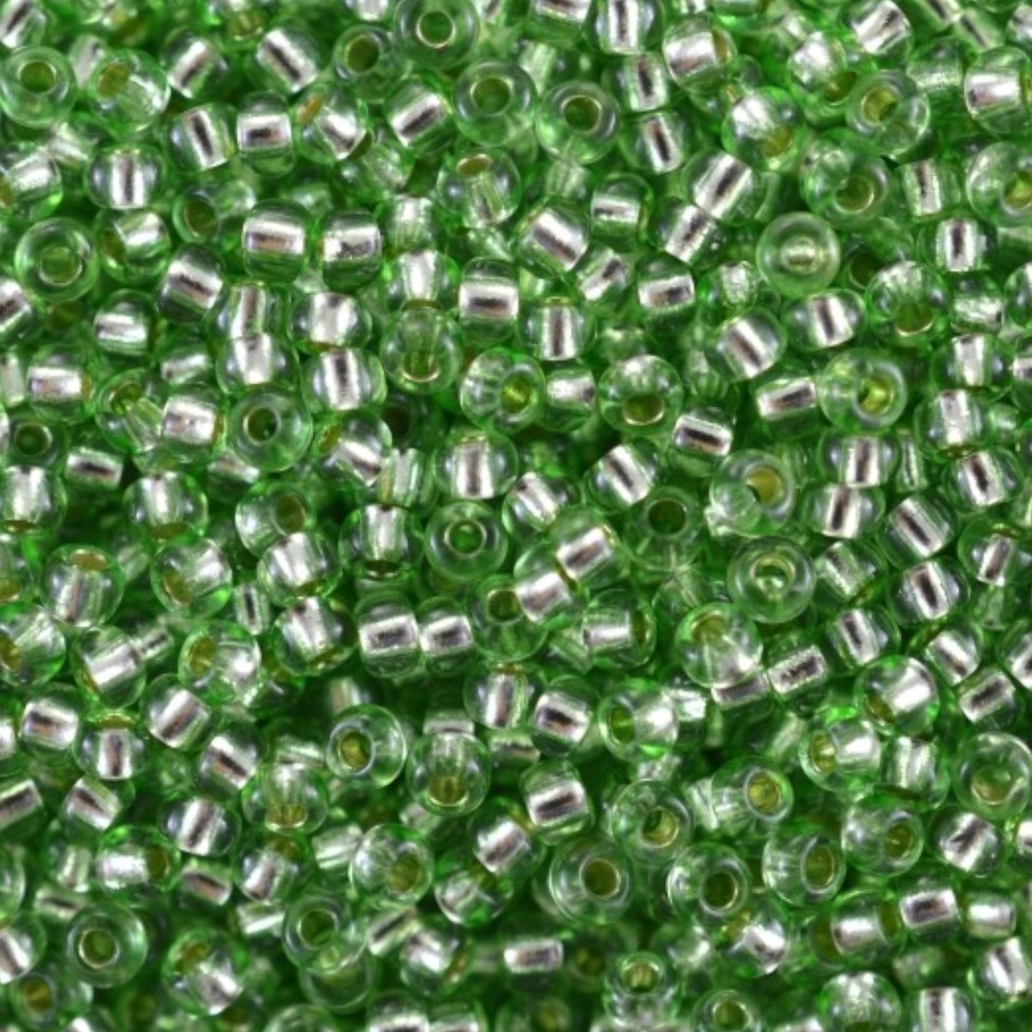 10/0 78161 Preciosa Czech Glass Seed Beads Rocailles 2.3mm. Green 2 dyed Crystal, Silver Lined.