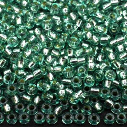 10/0 78164 Preciosa Czech Glass Seed Beads Rocailles 2.3mm. Green 2 dyed Crystal, Silver Lined.