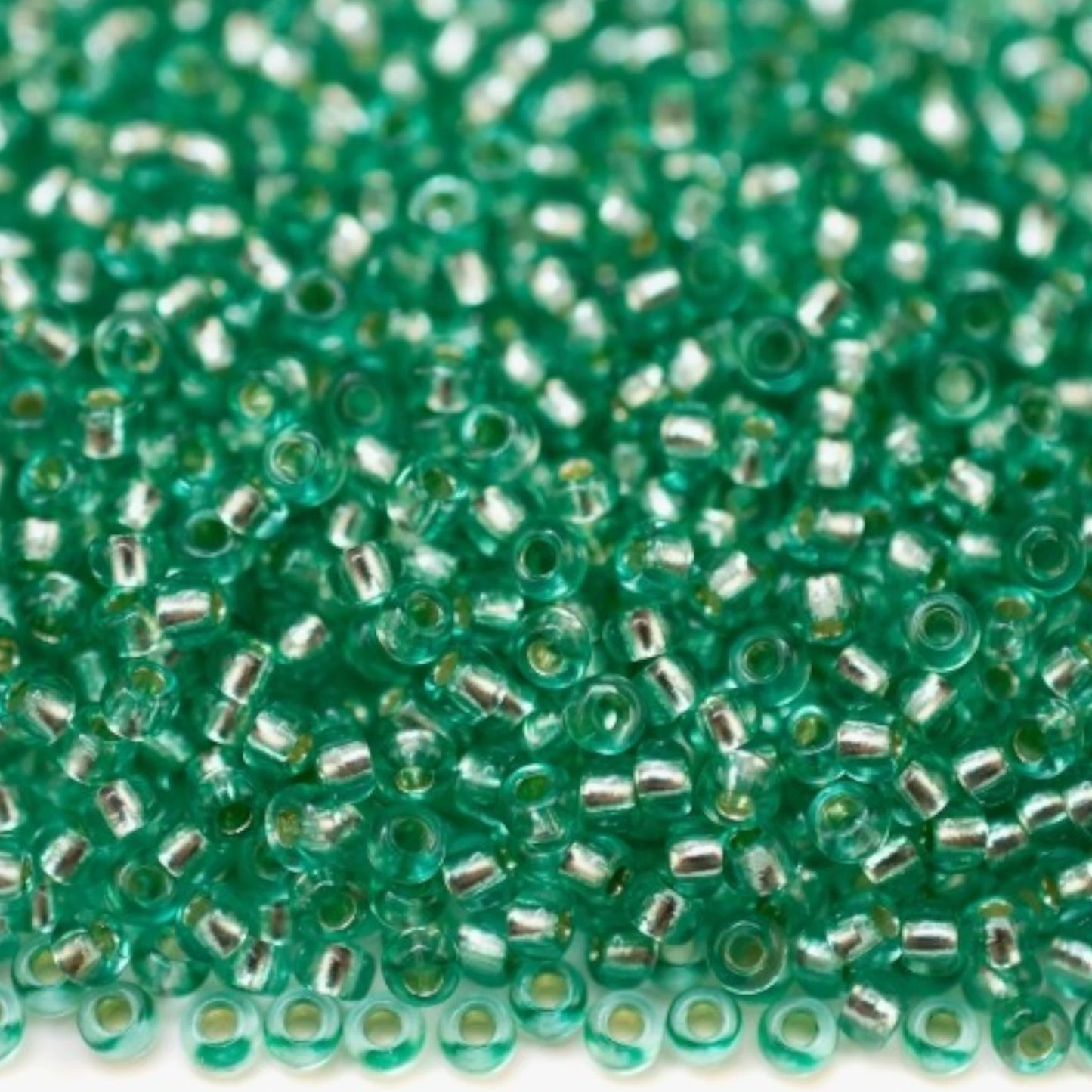 10/0 78164 Preciosa Czech Glass Seed Beads Rocailles 2.3mm. Green 2 dyed Crystal, Silver Lined.