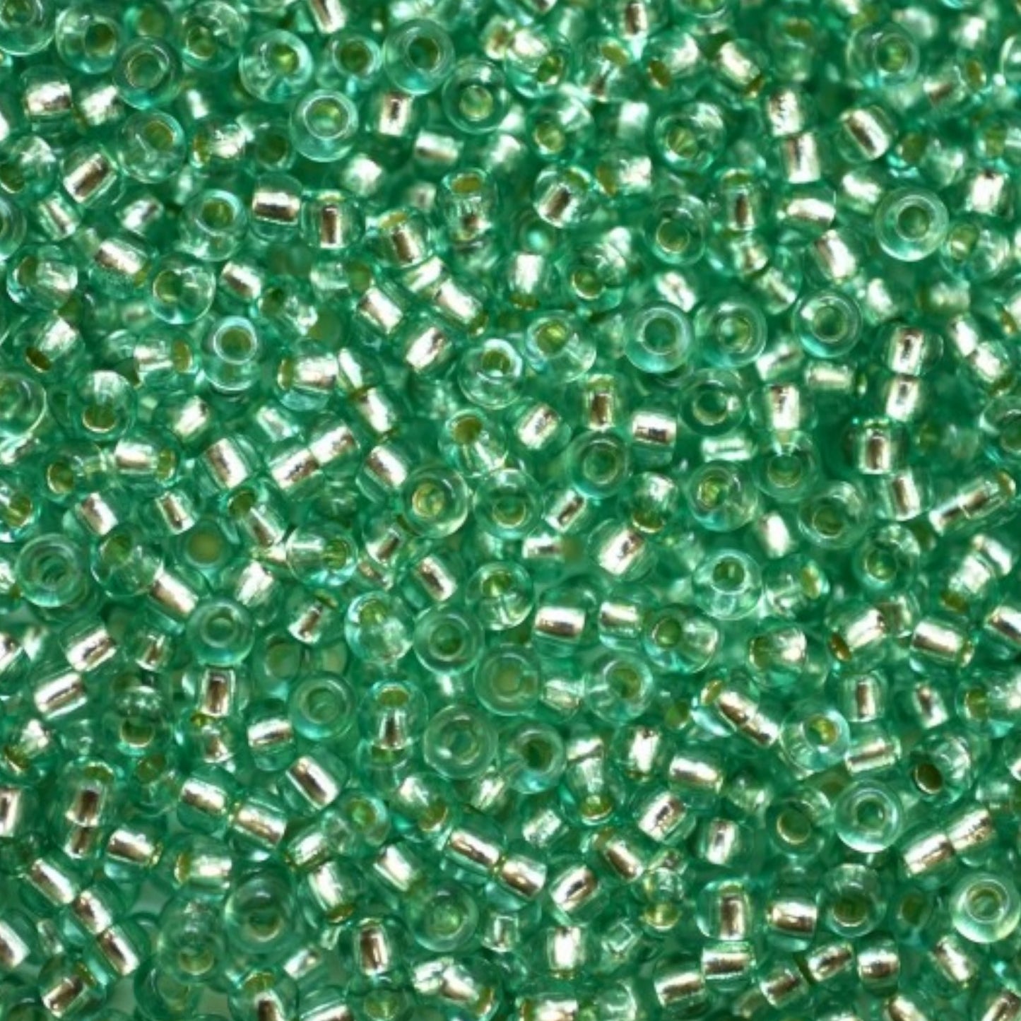 10/0 78164 Preciosa Czech Glass Seed Beads Rocailles 2.3mm. Green 2 dyed Crystal, Silver Lined.