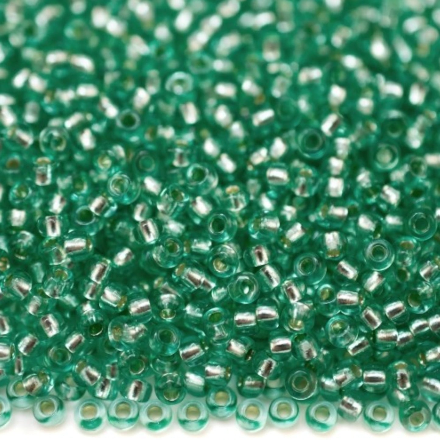 10/0 78164 Preciosa Czech Glass Seed Beads Rocailles 2.3mm. Green 2 dyed Crystal, Silver Lined.