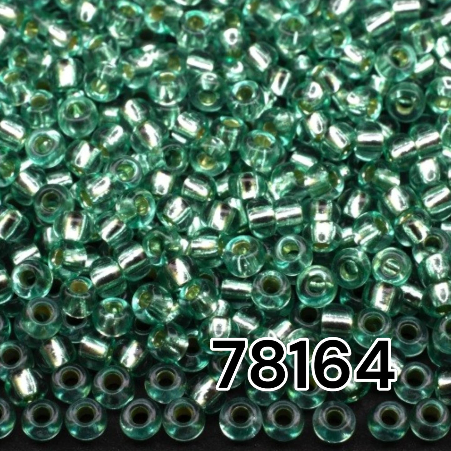 10/0 78164 Preciosa Czech Glass Seed Beads Rocailles 2.3mm. Green 2 dyed Crystal, Silver Lined.