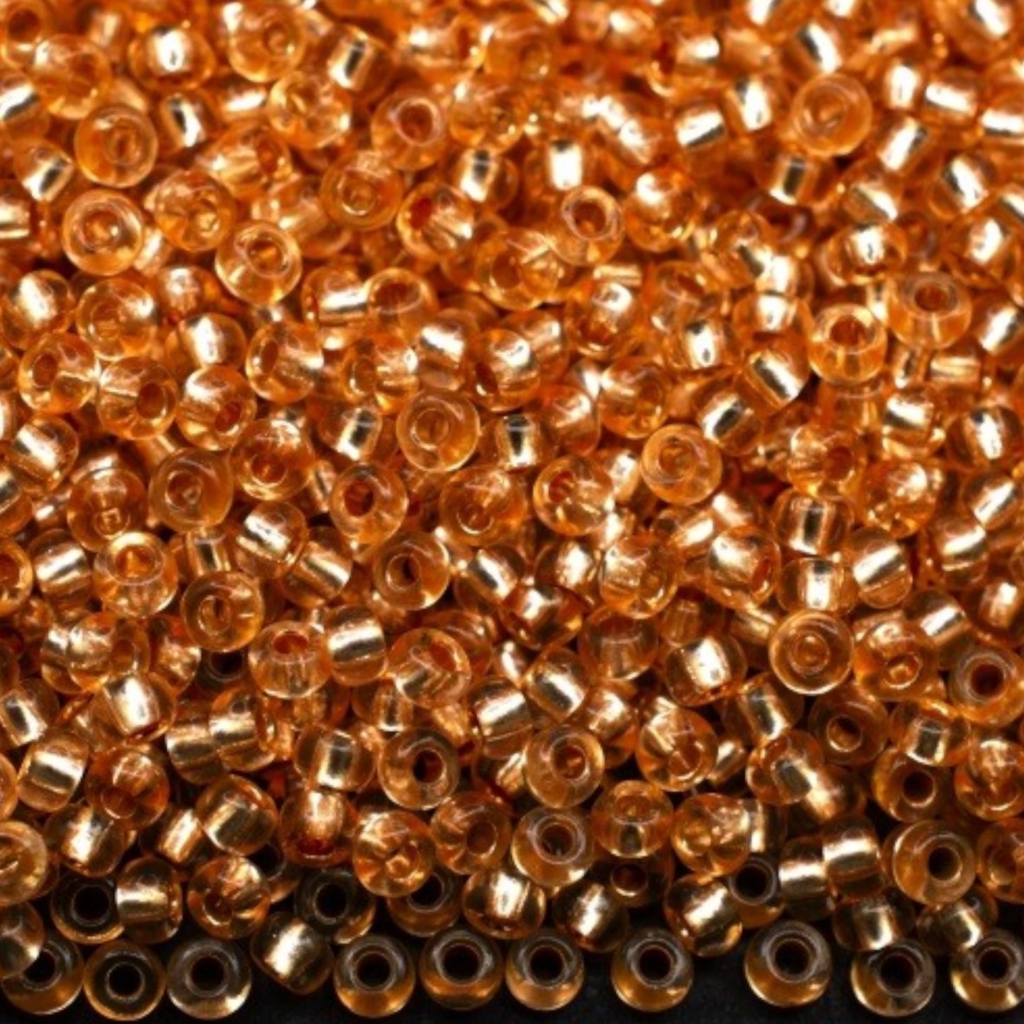 10/0 78184 Preciosa Czech Glass Seed Beads Rocailles 2.3mm. Orange 2 dyed Crystal, Silver Lined.