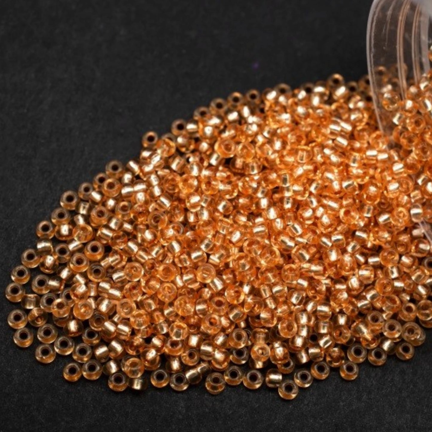 10/0 78184 Preciosa Czech Glass Seed Beads Rocailles 2.3mm. Orange 2 dyed Crystal, Silver Lined.