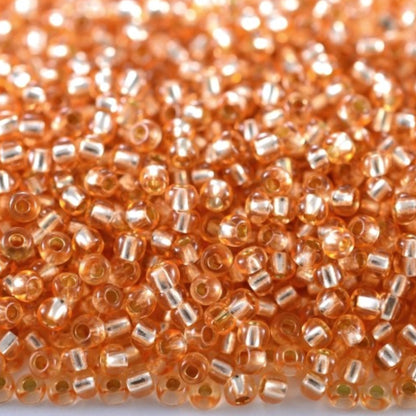 10/0 78184 Preciosa Czech Glass Seed Beads Rocailles 2.3mm. Orange 2 dyed Crystal, Silver Lined.