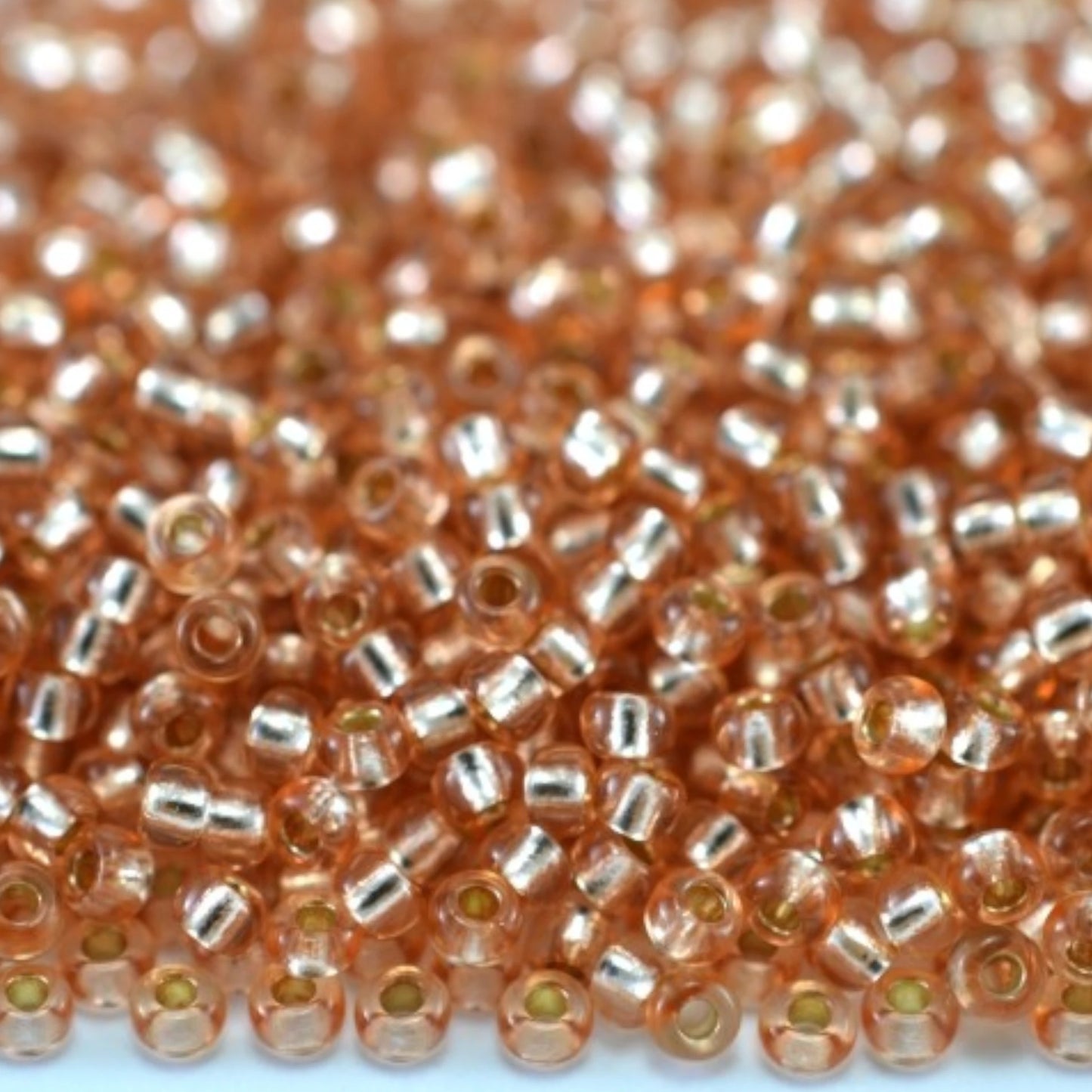 10/0 78185 Preciosa Czech Glass Perler Rocailles 2.3mm. Orange 2 farvet Krystal, Sølvbelagt.