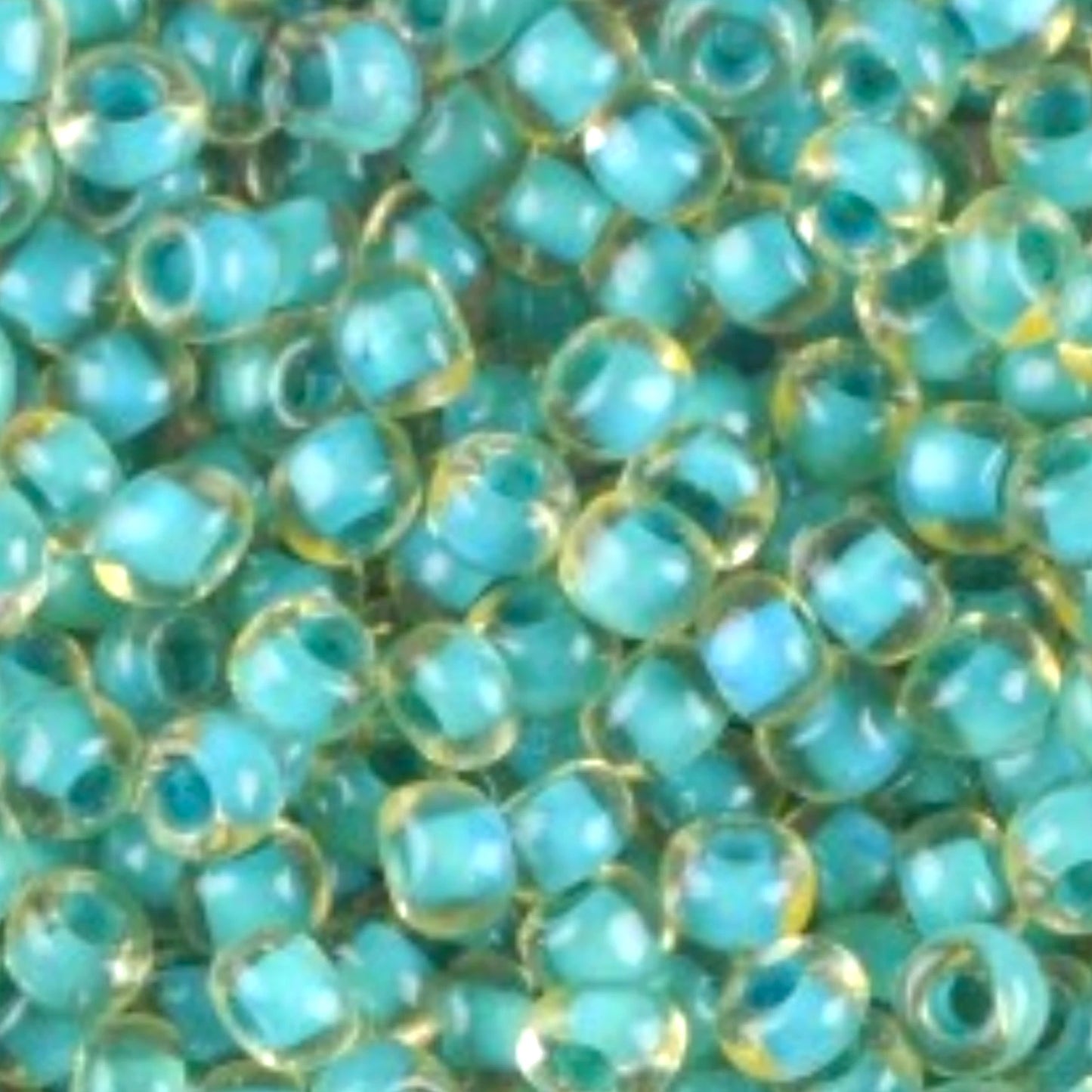 10/0 80836 Preciosa Cseh Üveg Magtartalmú Gyöngyök (Kásagyöngy) Rocailles 2.3mm. Zöld Kristály Terra Kék Szegélyezett.