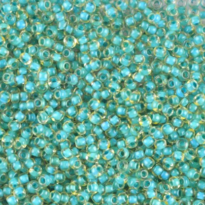 10/0 80836 Preciosa Cseh Üveg Magtartalmú Gyöngyök (Kásagyöngy) Rocailles 2.3mm. Zöld Kristály Terra Kék Szegélyezett.