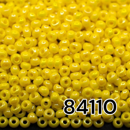 10/0 84110 Preciosa Seed Beads. Opaque rainbow yellow.