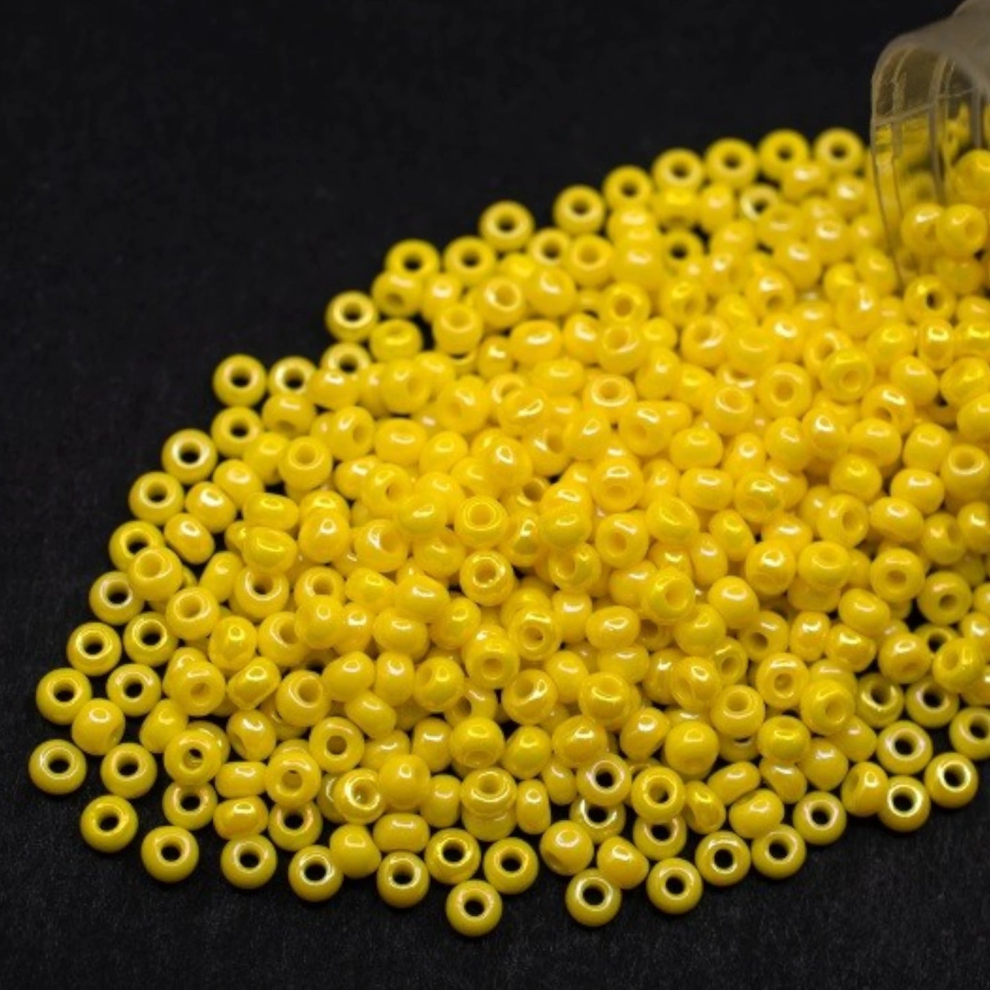 10/0 84110 Preciosa Seed Beads. Opaque rainbow yellow.