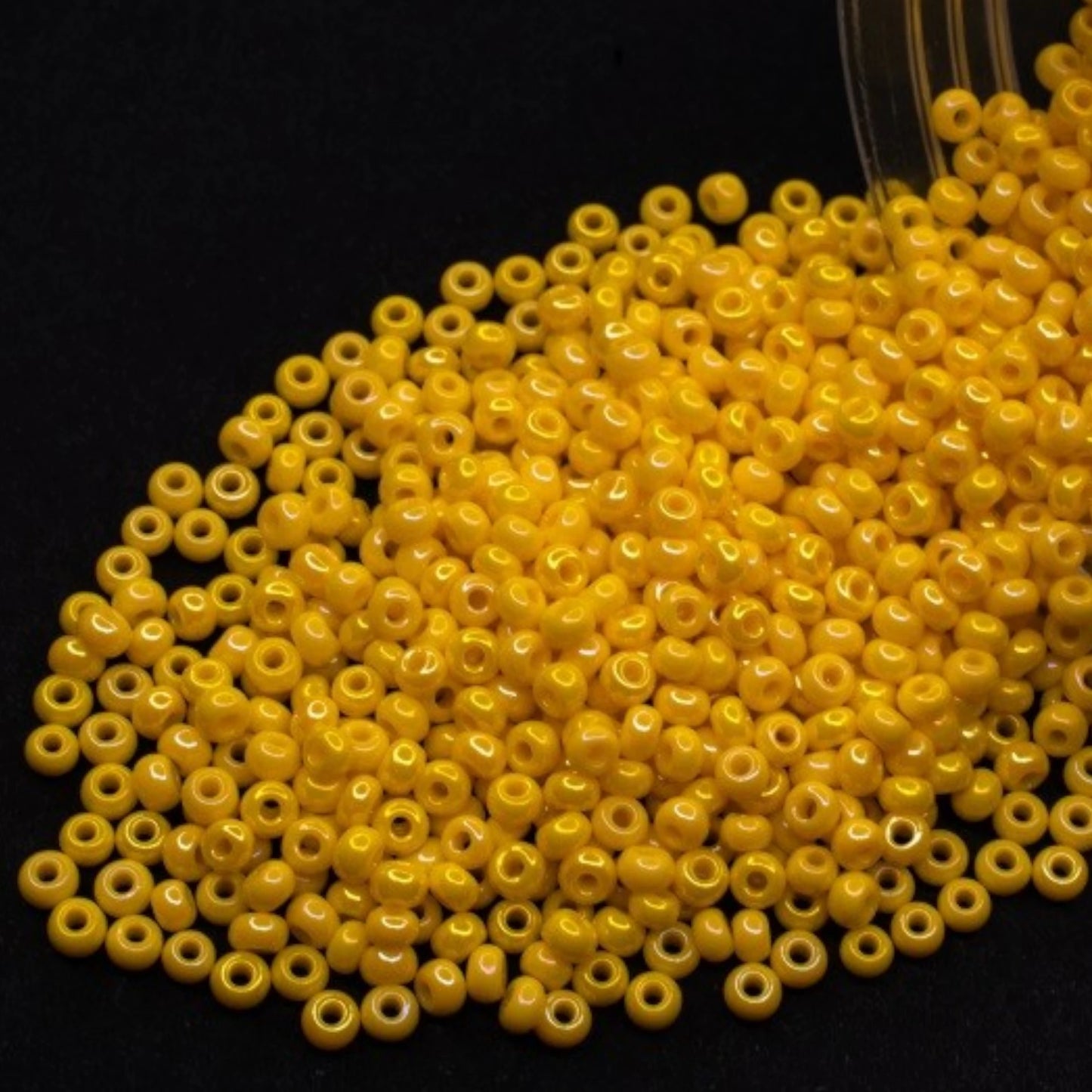 10/0 84130 Preciosa Seed Beads. Opaque rainbow yellow.