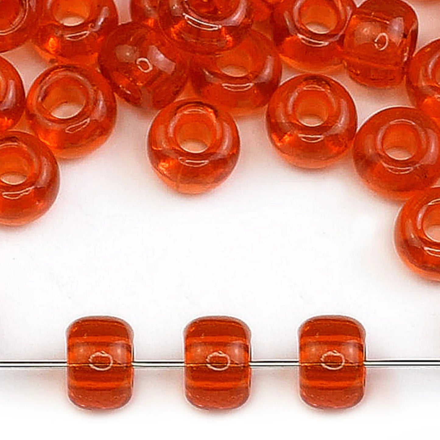 2/0 90030 Preciosa Čekiško Stiklo Karoliukai Rokajaus 6.1mm. Oranžinė Skaidri Natūrali.