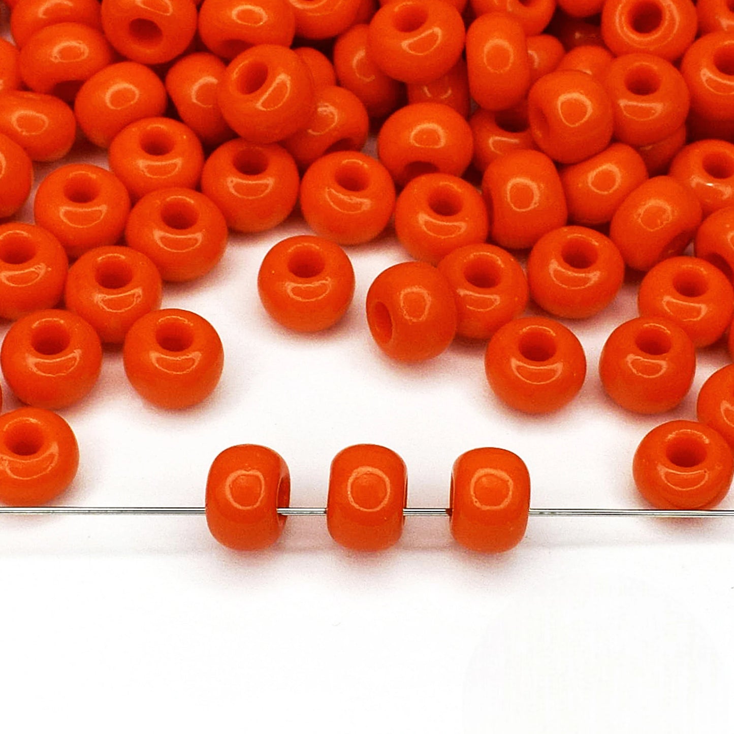 2/0 93140 Preciosa Seed Beads Orange. Opaque natural.