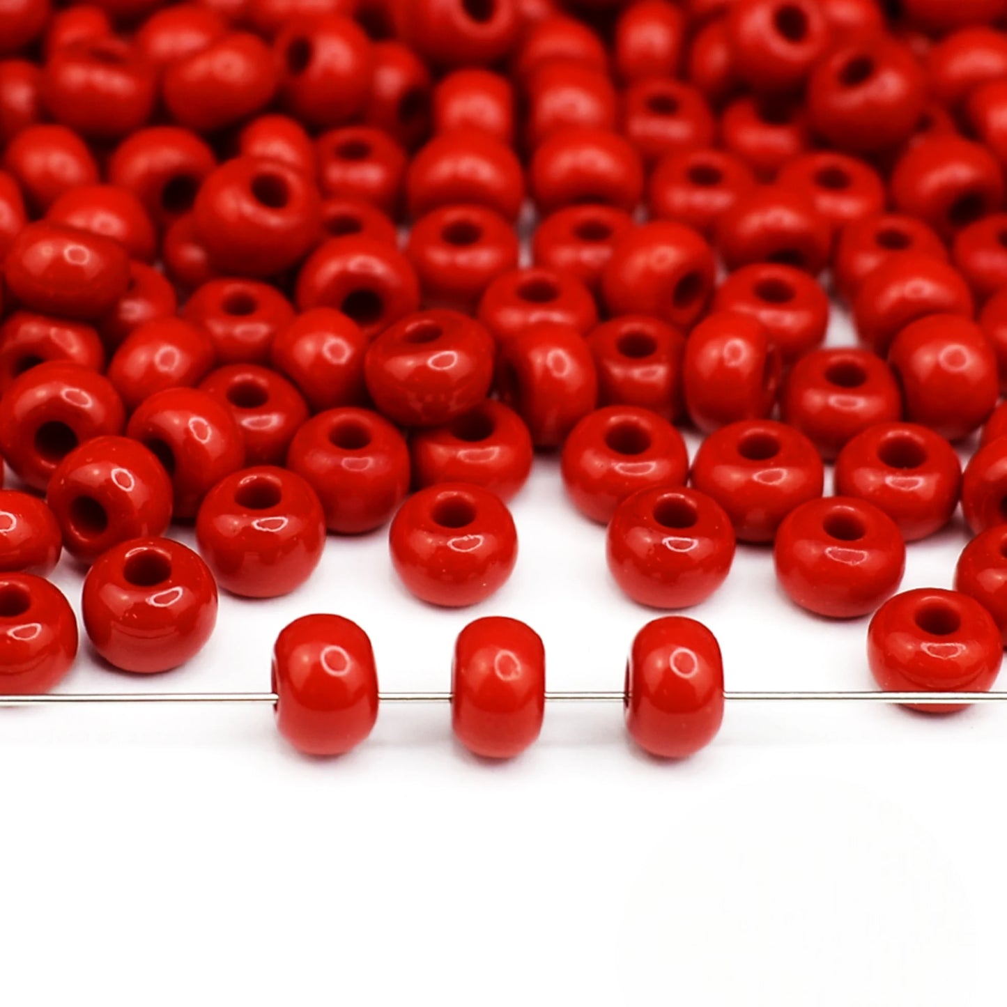 2/0 93170 Preciosa Seed Beads Red. Opaque natural.