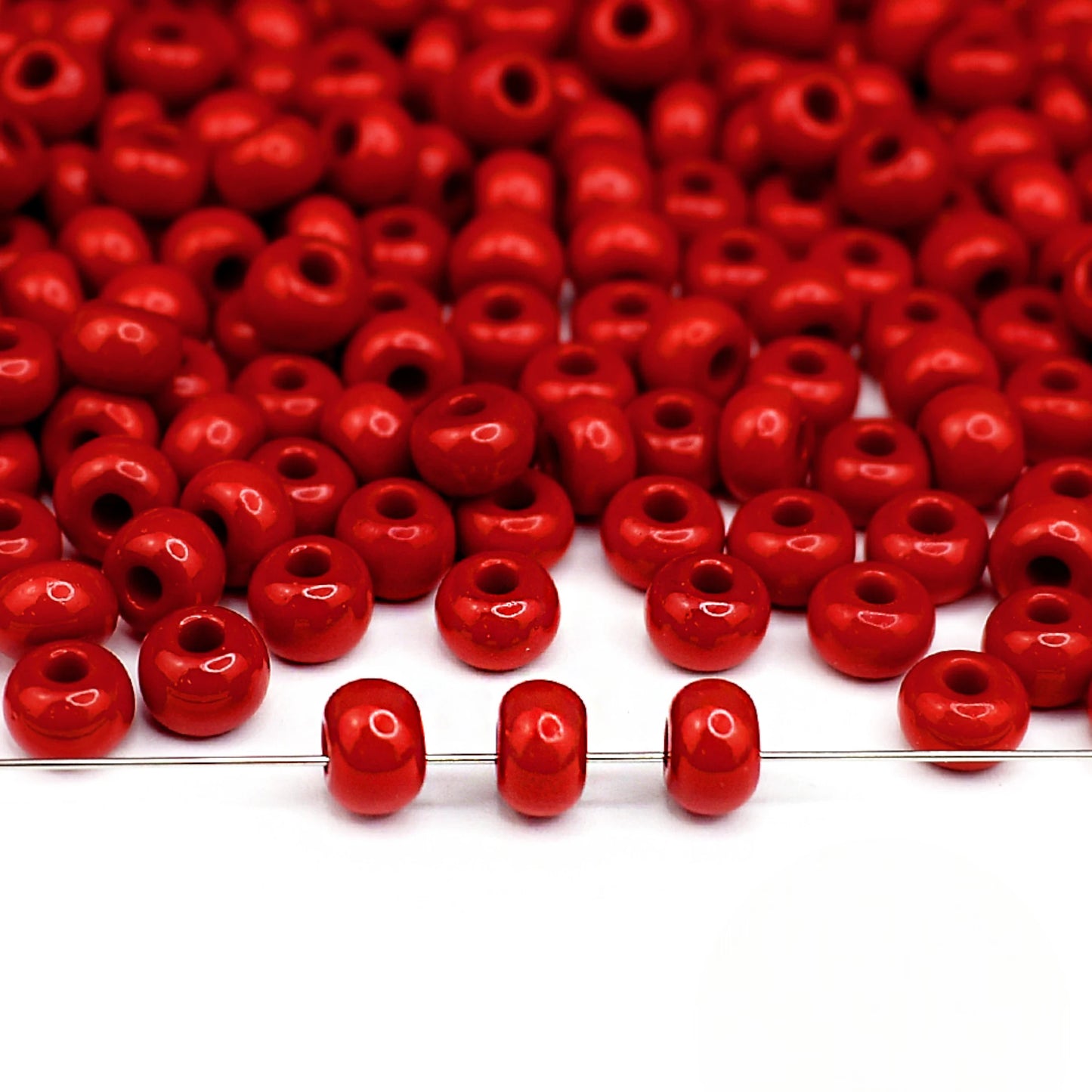 2/0 93190 Preciosa Seed Beads Red. Opaque natural.