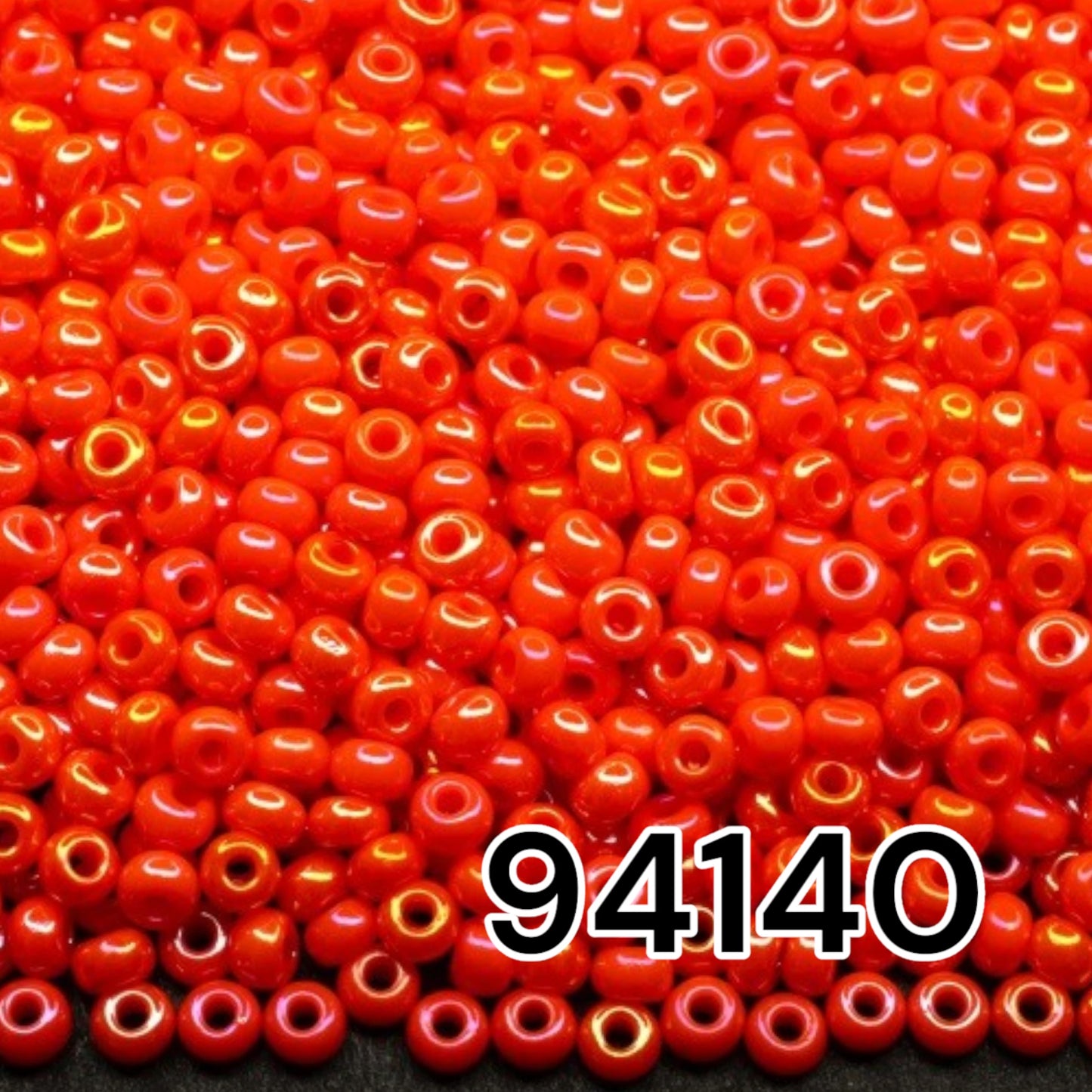 10/0 94140 Preciosa Seed Beads. Opaque rainbow orange.