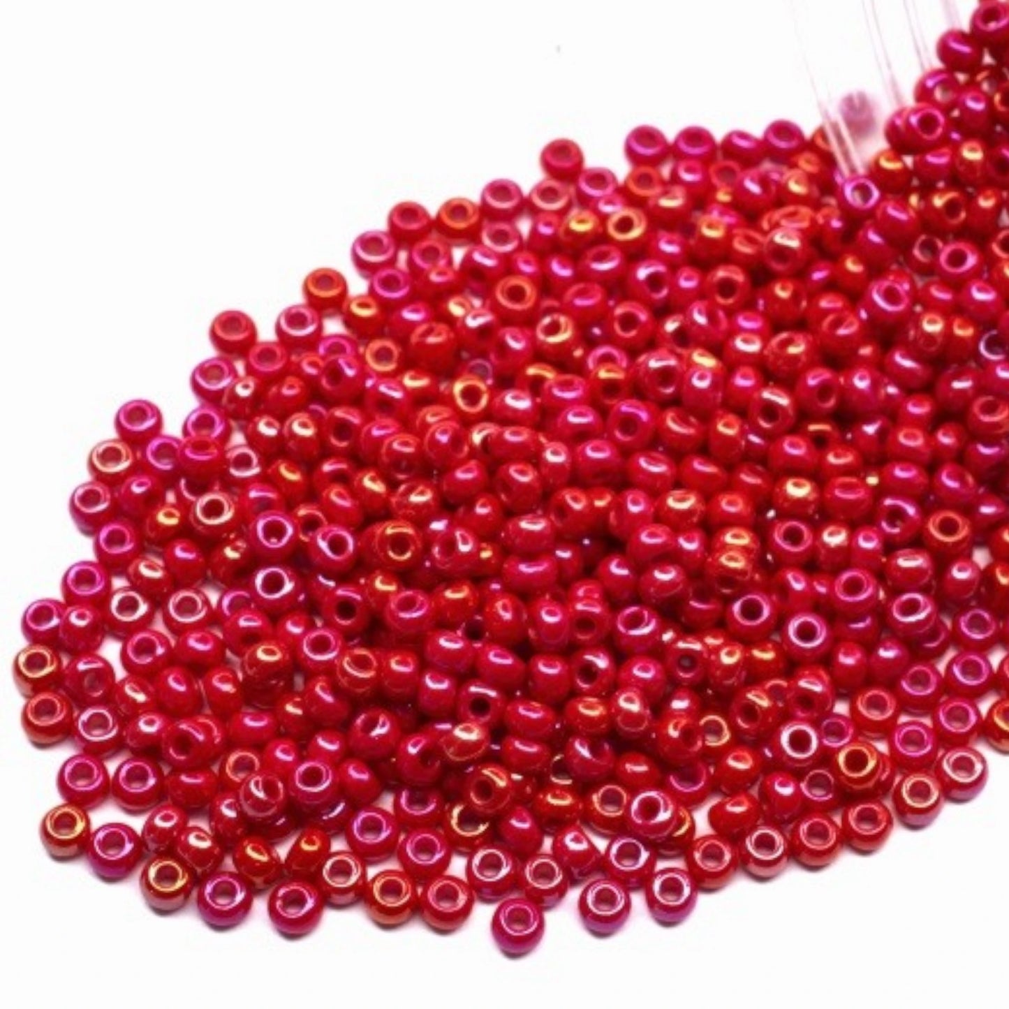 10/0 94190 Preciosa Seed Beads. Opaque rainbow red.