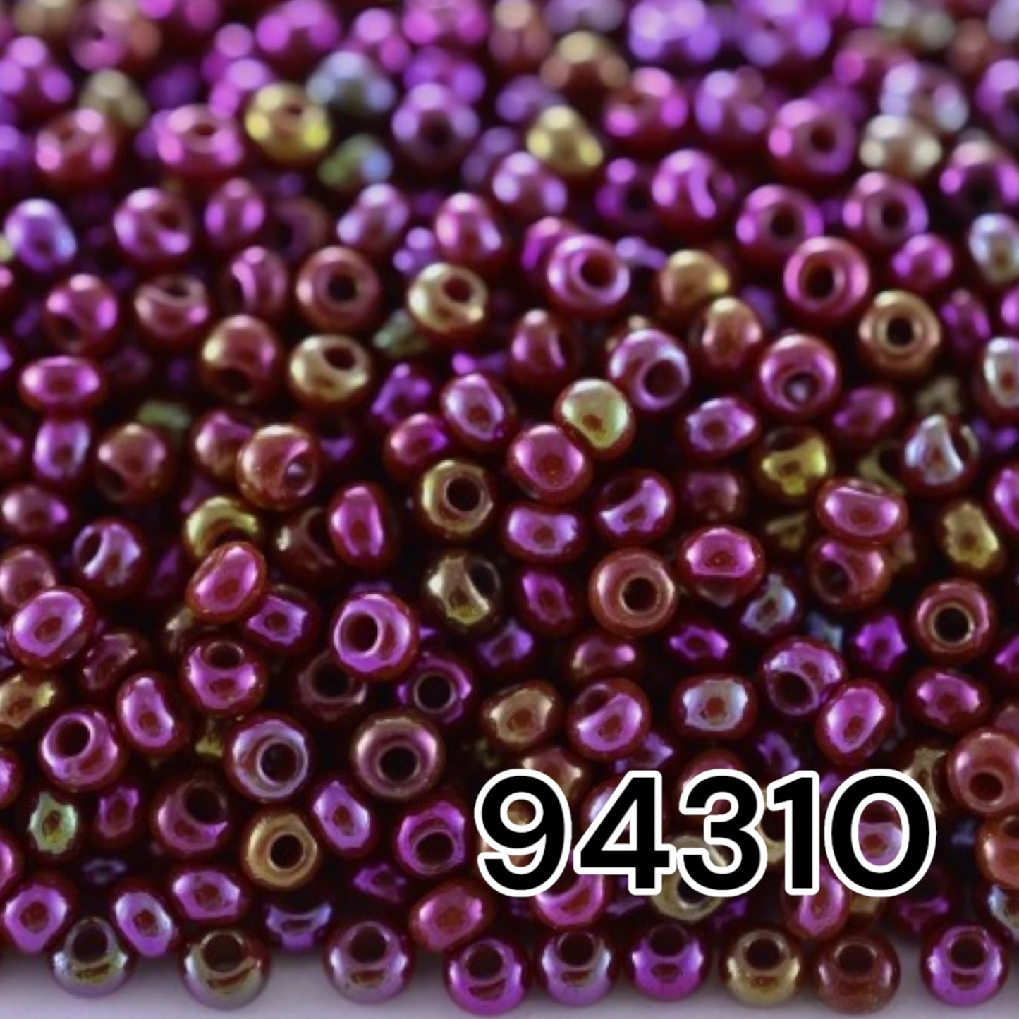 10/0 94310 Preciosa Seed Beads. Opaque rainbow burgundy .