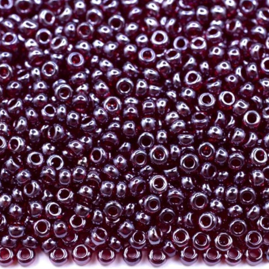 10/0 96120 Preciosa tjekkiske glasperler Perler Rocailles 2.3mm. Granat transparent Sfinx.