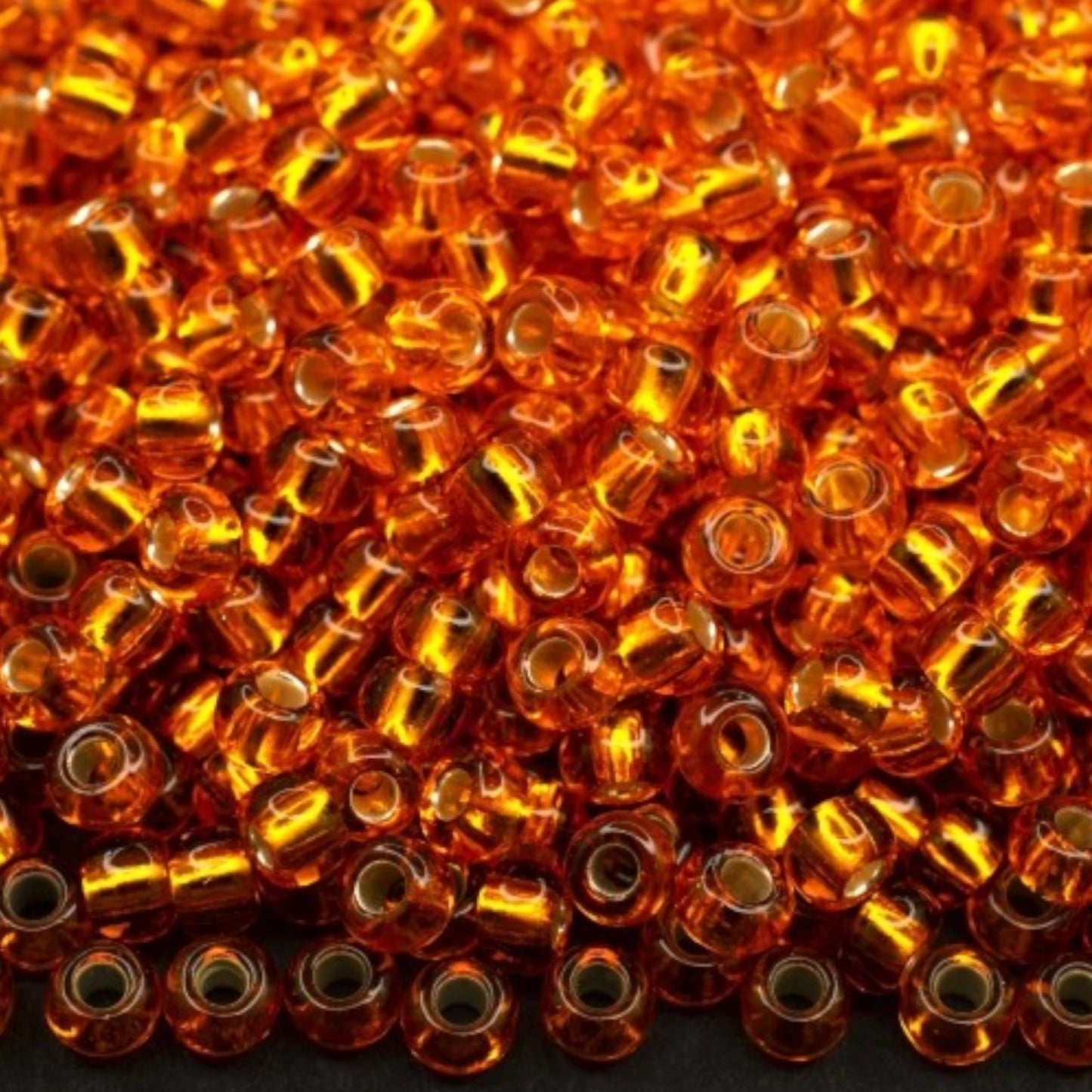 10/0 97 000 perles de rocaille Preciosa. Orange transparent doublé argent.